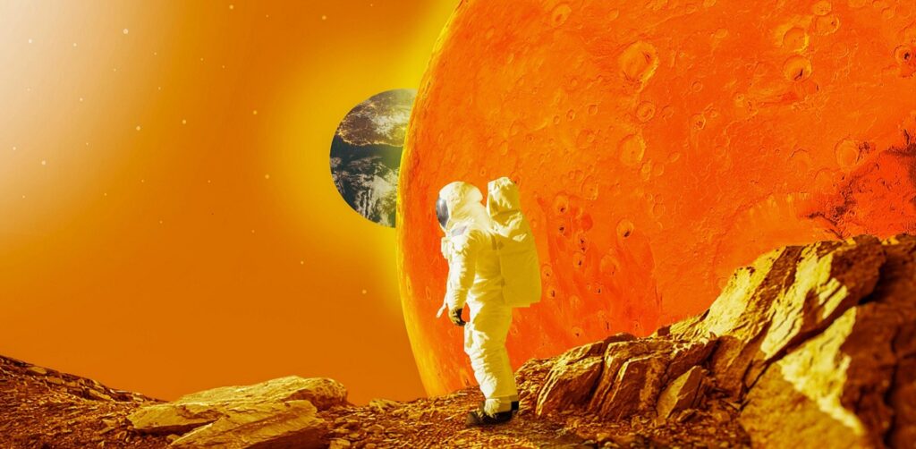 Two astronauts in white suits stand on orange rocky terrain with Earth visible in the background near a giant orange planet.